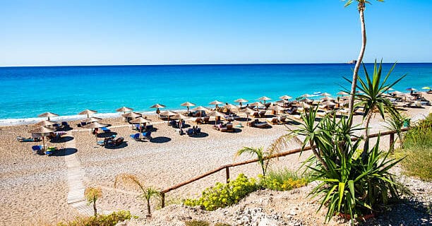 Sandy Gialos beach with umbrellas and sunbeds on Lefkada island